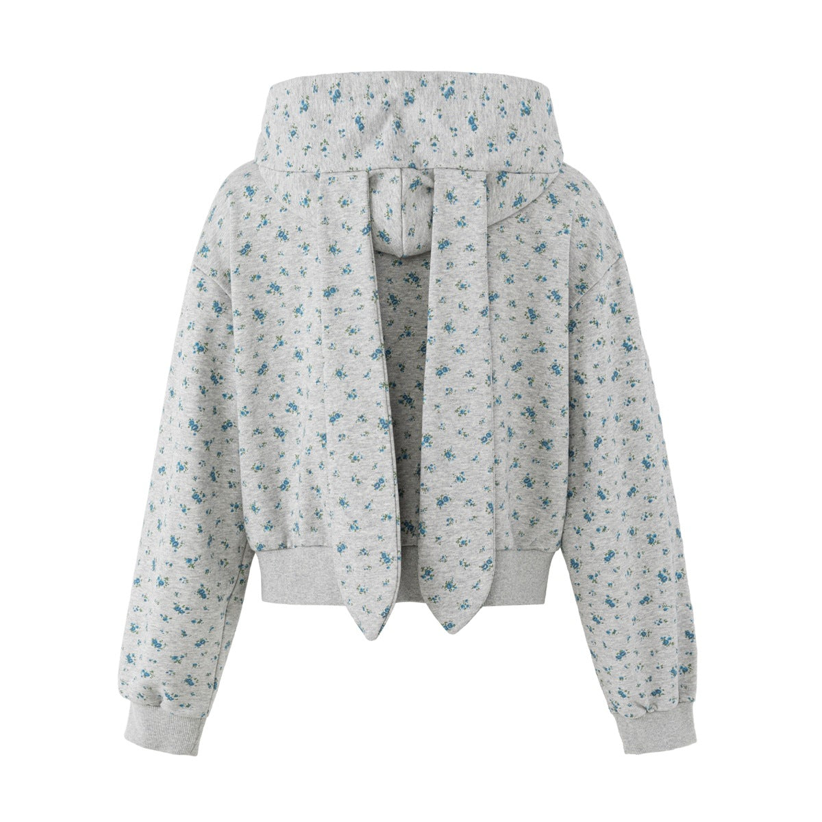 Back view of a gray-blue floral-print cropped hoodie with ribbed cuffs and long pointed hood panels.