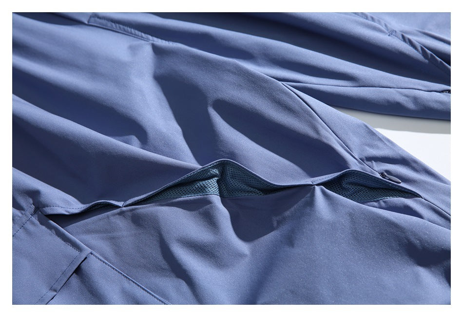 Blue garment detail showing a zippered mesh ventilation panel.