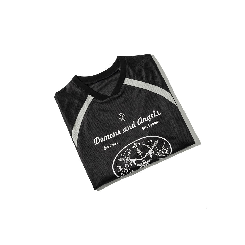 Folded black jersey with light gray stripes, a V-neck, and a white graphic print on the front.