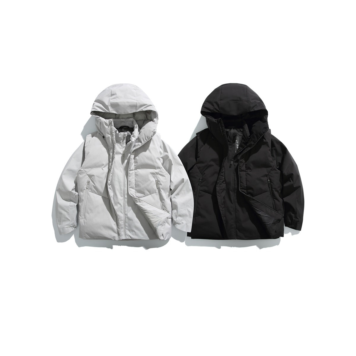 Two hooded jackets shown flat, one light gray and one black, with front zippers and pockets.