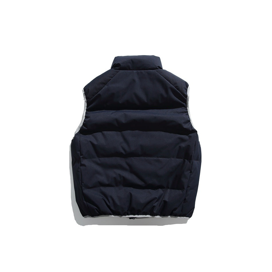 Back view of a dark navy sleeveless padded vest with horizontal quilting and light trim at the armholes.