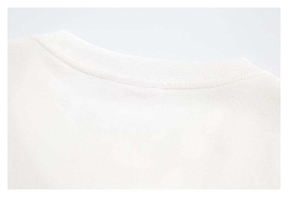 Close-up of an off-white shirt's ribbed crew neckline and collar stitching.