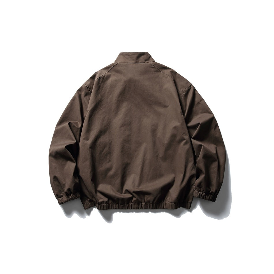 Back view of brown stand-collar jacket with elastic cuffs and hem, laid flat