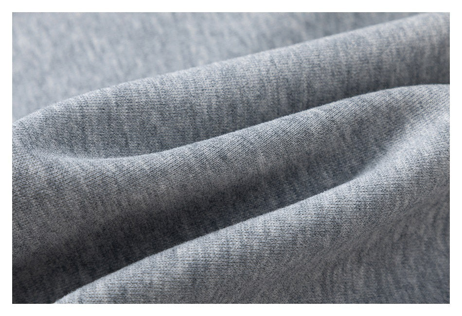Close-up showing the heathered texture of gray fabric.