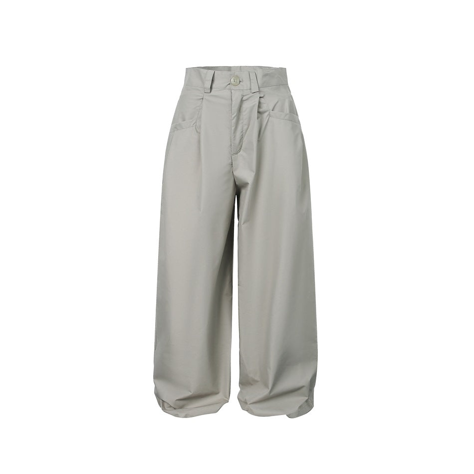 Light gray high-waisted wide-leg trousers with front pleats and button closure, flat front view