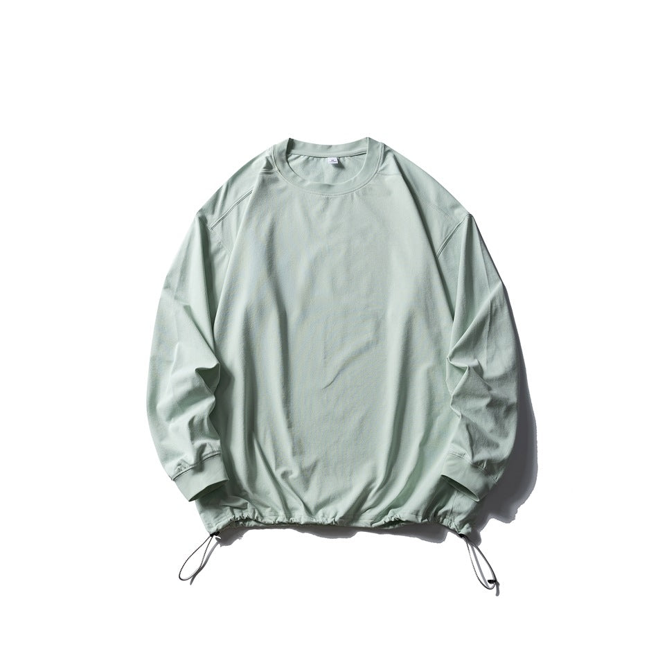 Pale mint green long-sleeve crew-neck top flat lay with drawstring hem and toggle cords