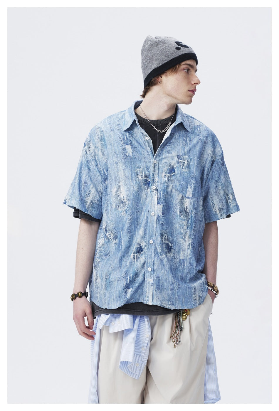 Model wearing the light blue distressed-pattern short-sleeve shirt, shown facing forward in profile.