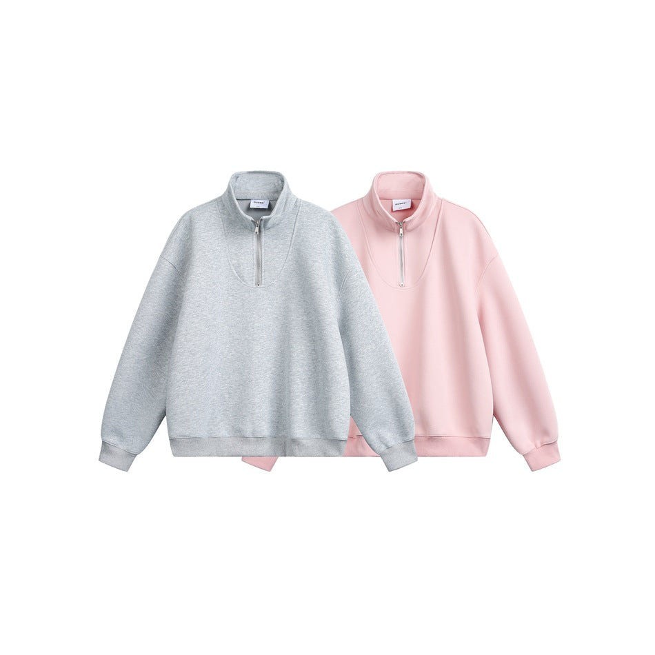 Two quarter-zip pullovers shown together, one light gray and one pale pink.