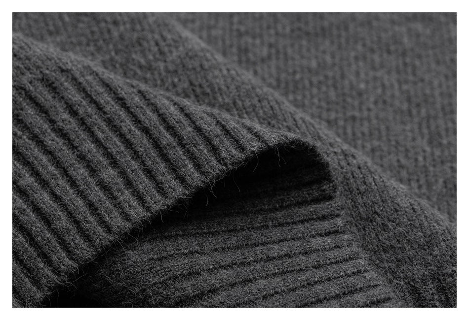 Close-up of a gray rib-knit cuff folded over the garment.