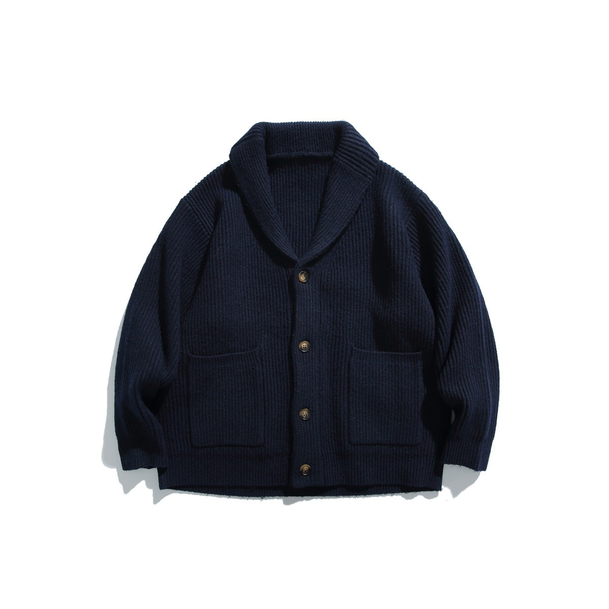 Navy ribbed knit shawl-collar cardigan with four buttons and two patch pockets, flat lay