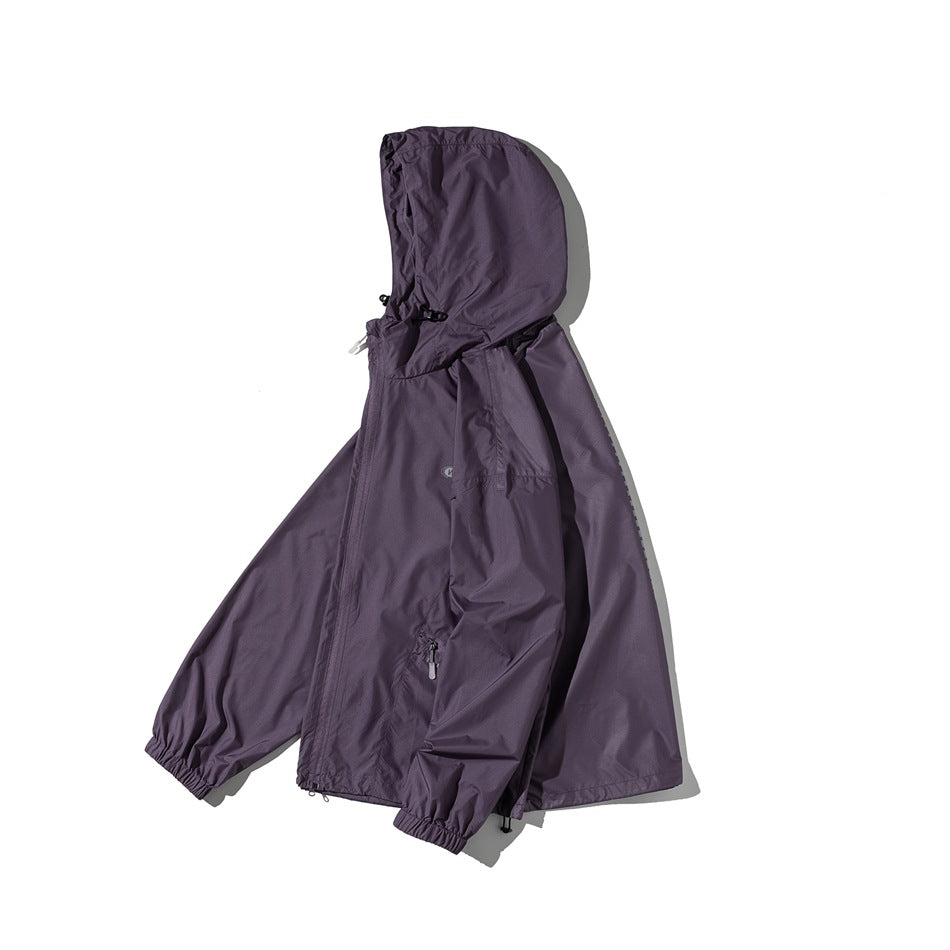 Purple hooded jacket shown from the front, with a full-length zipper, front pockets, and elastic cuffs.