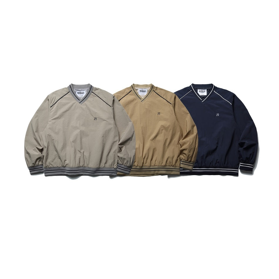 Three front-facing V-neck jackets in light gray, tan, and navy, each with contrasting piping and striped trim.