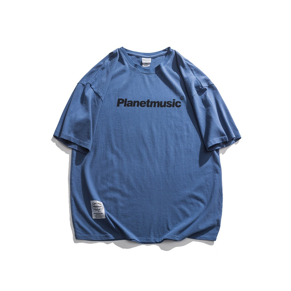 Blue short-sleeve crew-neck T-shirt with black chest lettering print and small white hem label, flat lay