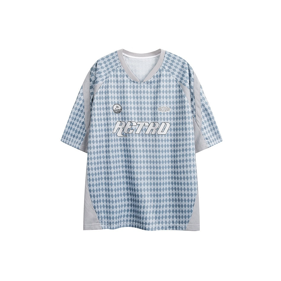 Front of a light blue diamond-print short-sleeve jersey tee with gray trim, RETRO chest graphic and two small patches