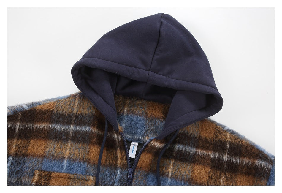 Close-up of the navy hood, drawstrings and front zipper against the fuzzy brown and blue plaid jacket.