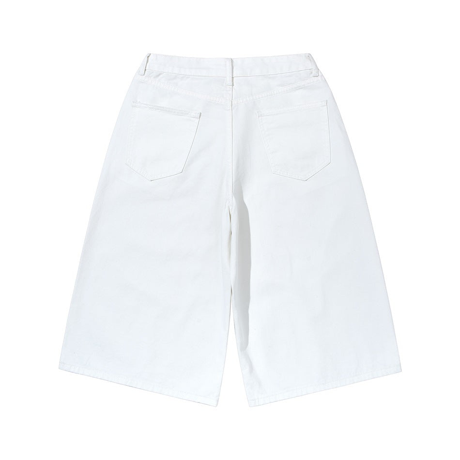 Back view of white wide-leg cropped pants with two patch pockets and a waistband.