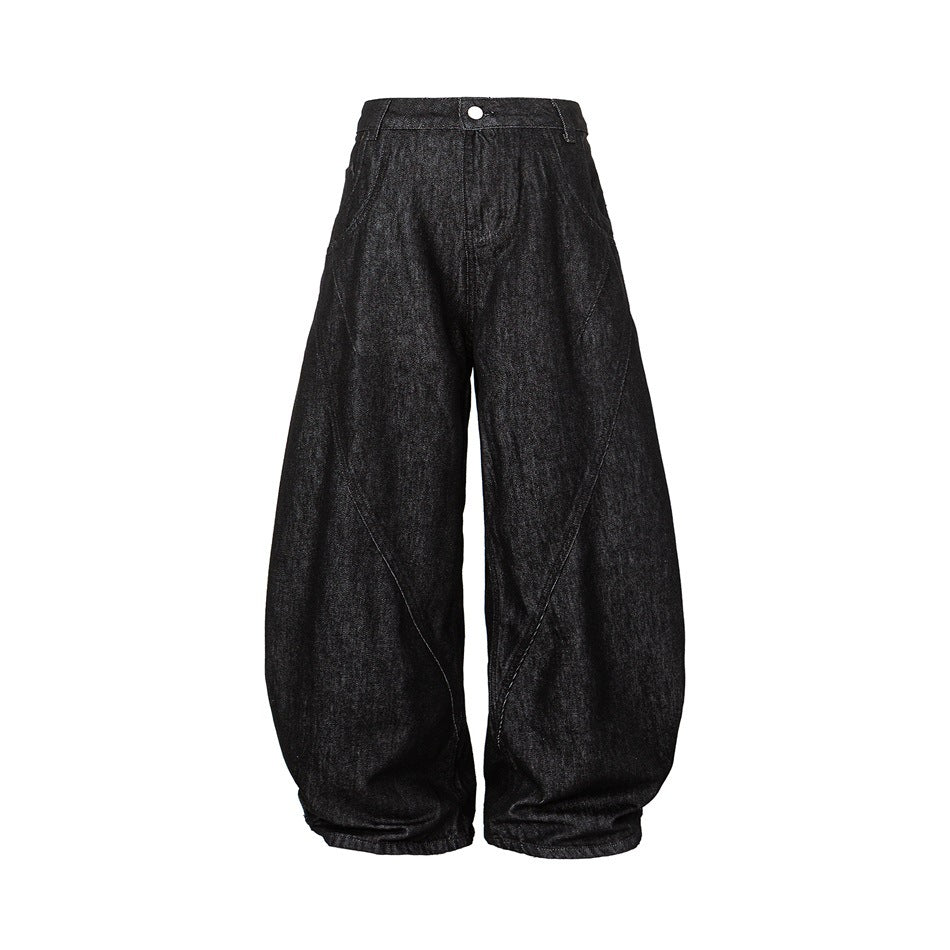 Black washed denim barrel-leg jeans, front view, with curved leg seams, button closure and belt loops
