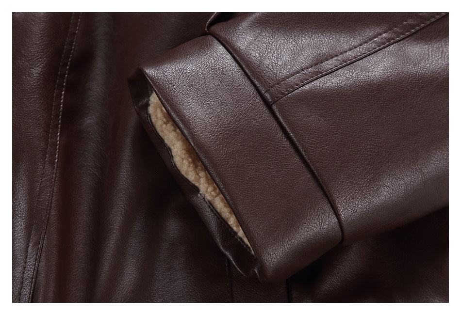 Close-up of a dark brown jacket cuff folded back to show its cream plush lining.