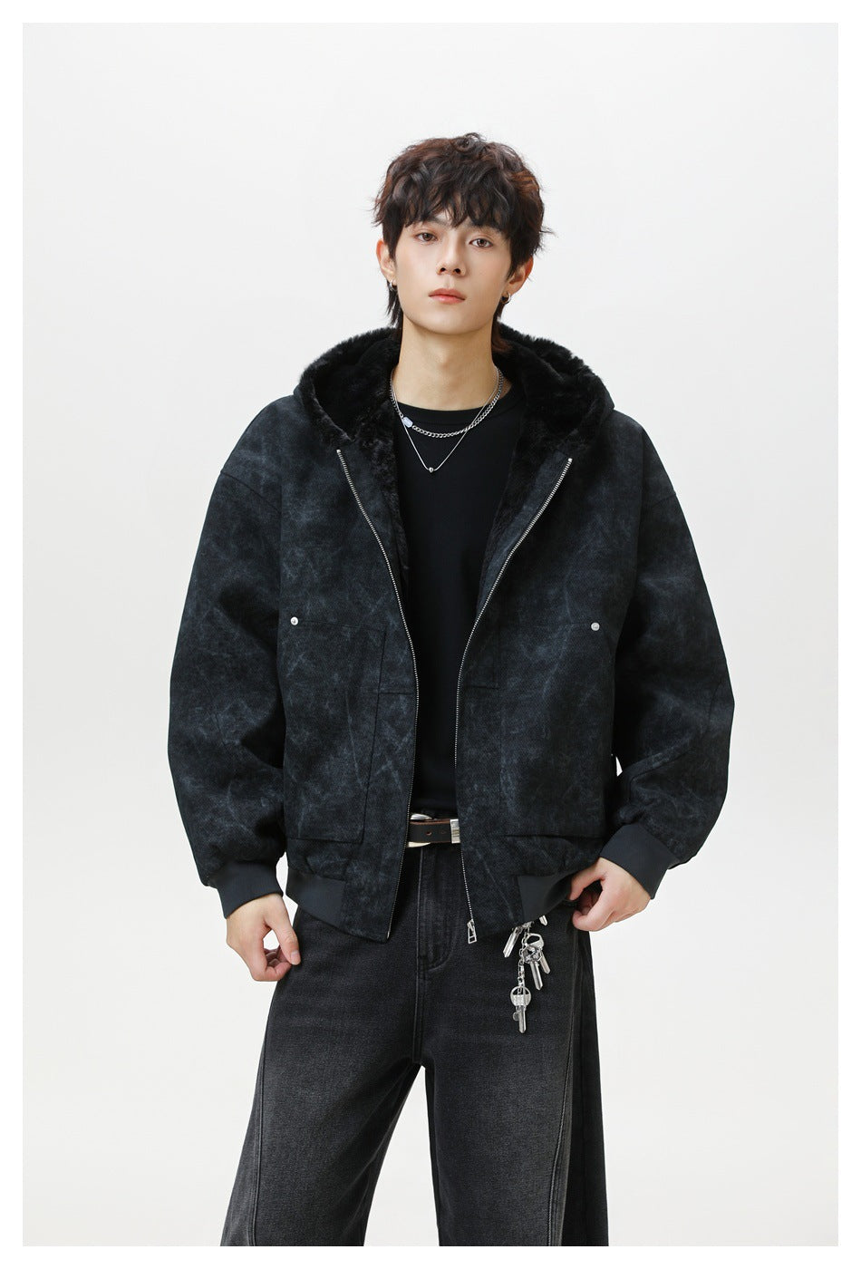 Model wearing a charcoal mottled hooded jacket with black plush lining, a silver zipper, and large front pockets.