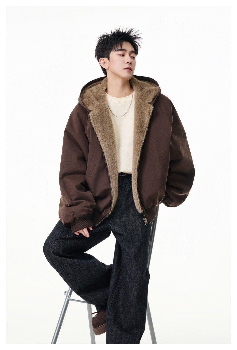 Model wearing an open dark brown hooded jacket with taupe plush lining and ribbed cuffs and hem.