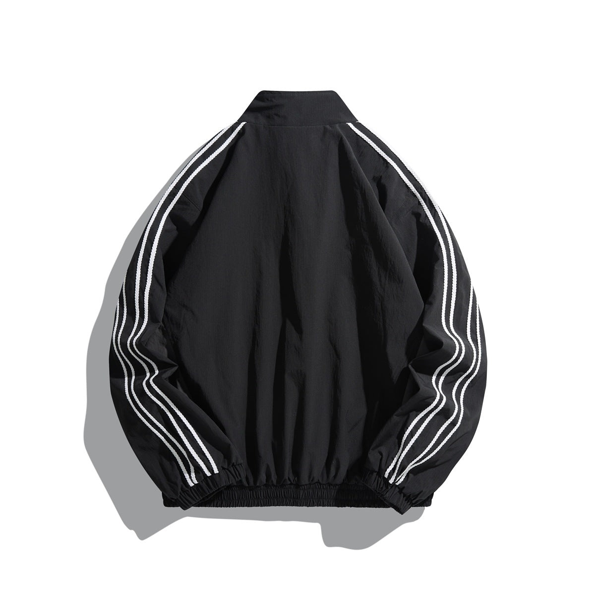 Back view of black stand-collar jacket with three white stripes on each sleeve and elastic hem and cuffs