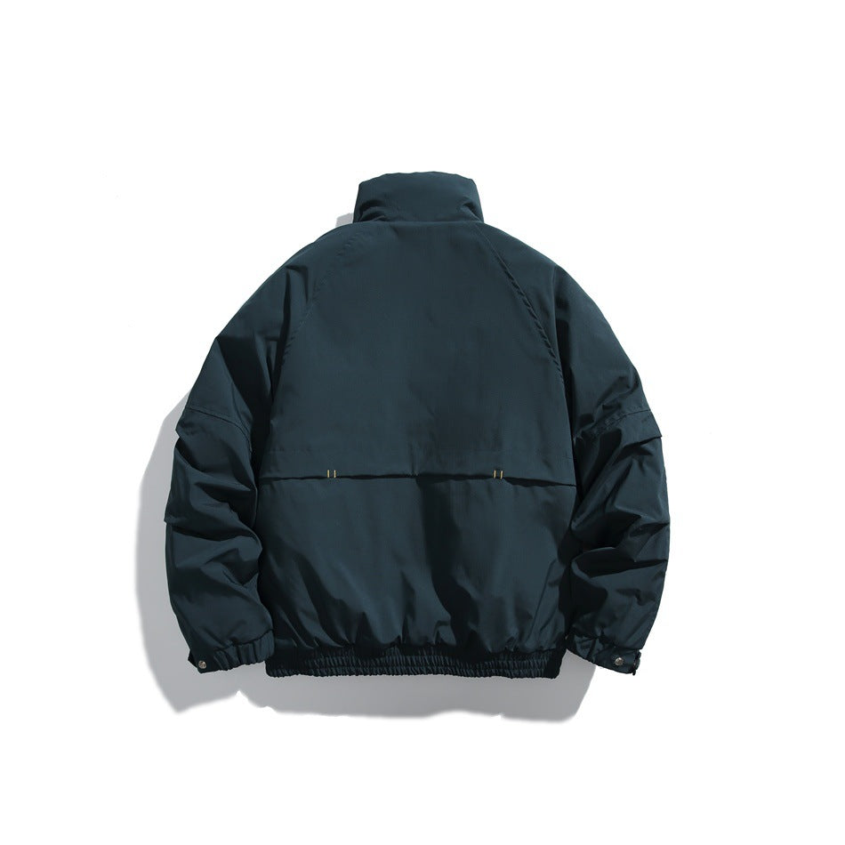 Back view of a dark navy jacket with a high collar, gathered hem, and long sleeves.