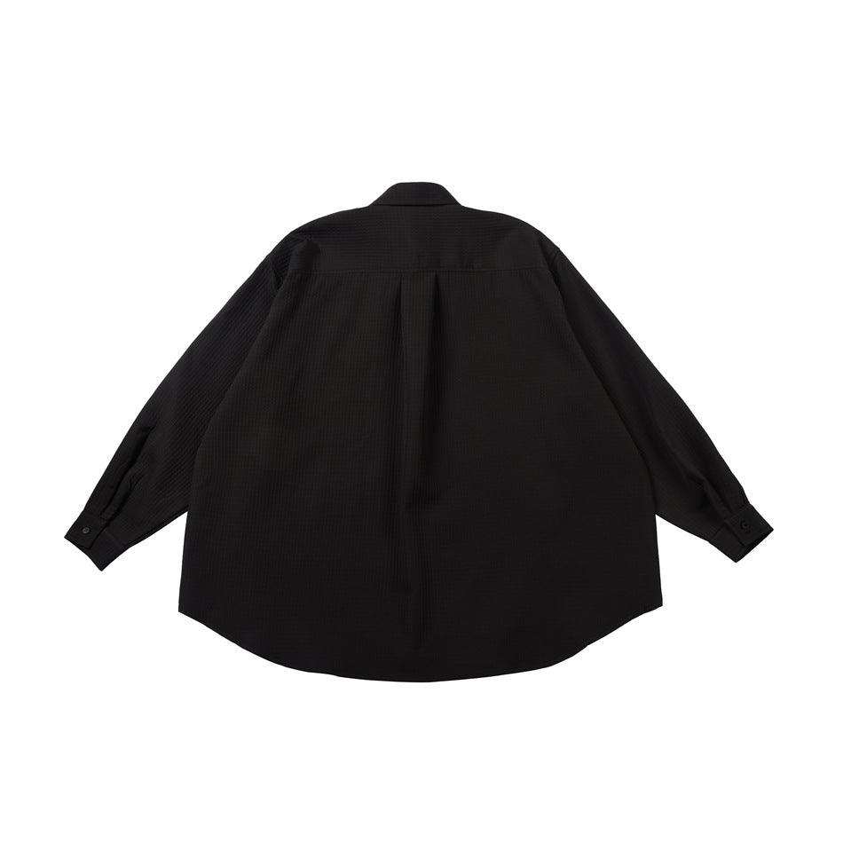Back view of a black long-sleeved collared shirt with a center pleat and curved hem.