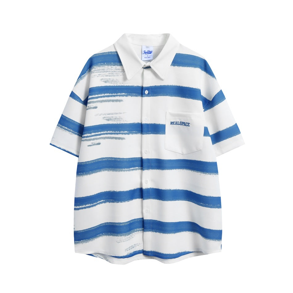 White short-sleeve button-up shirt with blue brush-stroke horizontal stripes and a chest pocket with embroidered lettering