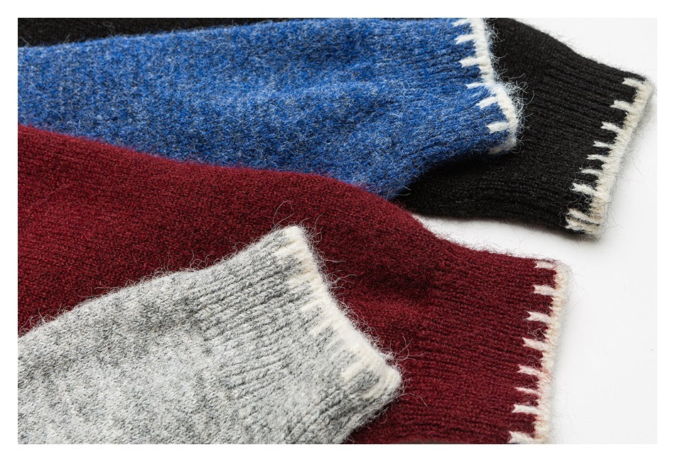 Close-up of sweater cuffs in blue, black, burgundy, and gray, each finished with a white patterned edge.
