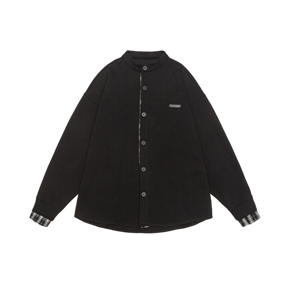 Black button-front stand-collar jacket with plaid placket lining and cuffs, flat lay front view
