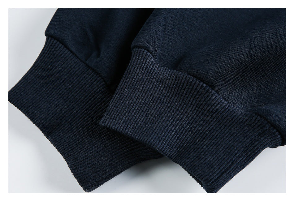 Close-up of dark navy ribbed cuffs or hem on a matching garment.