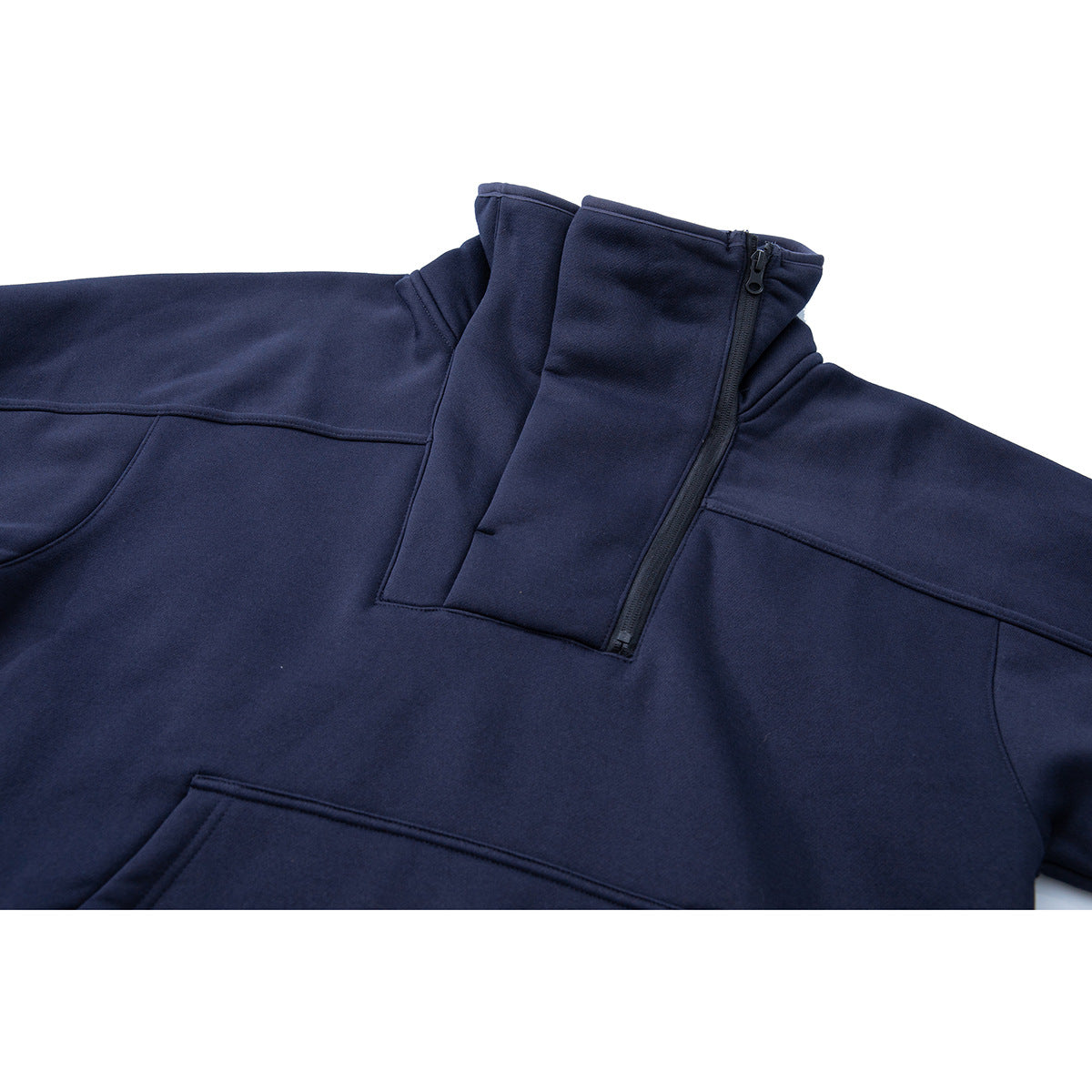 Close-up of a navy pullover's high collar, quarter zipper, shoulder seams, and upper kangaroo pocket.