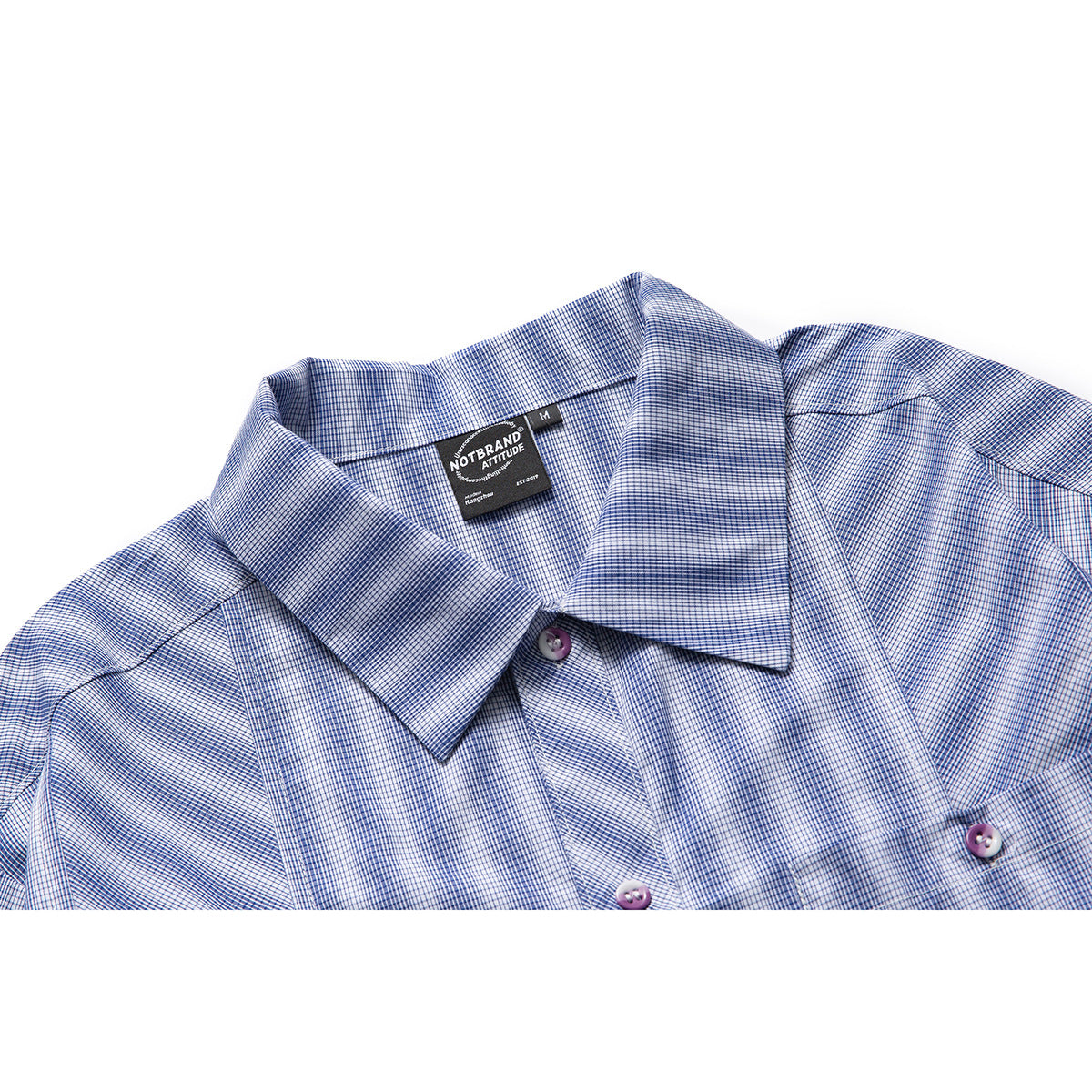 Close-up of a blue-and-white fine-check shirt collar, placket, and buttons on a white background.