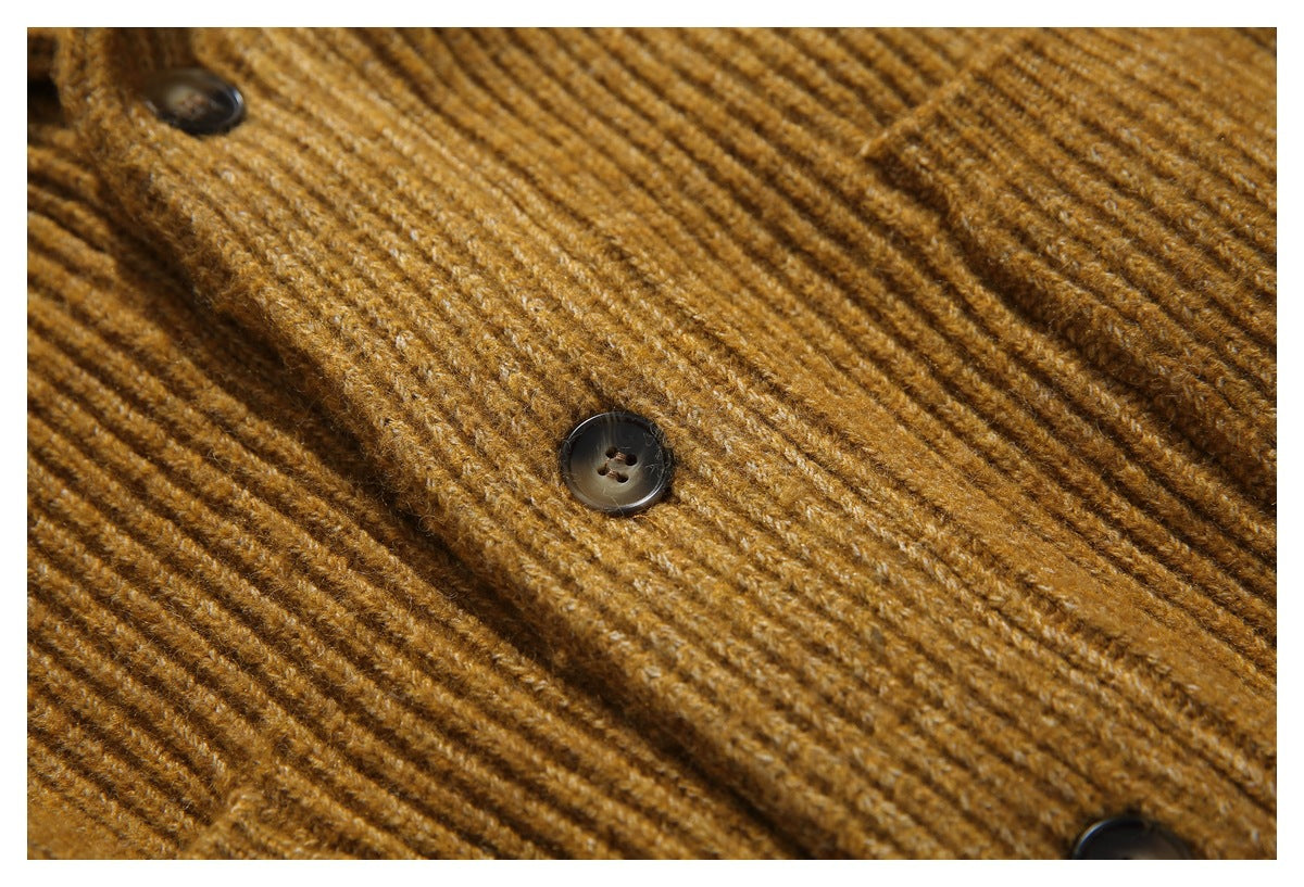 Close-up showing the mustard-brown ribbed knit and dark buttons on the cardigan.