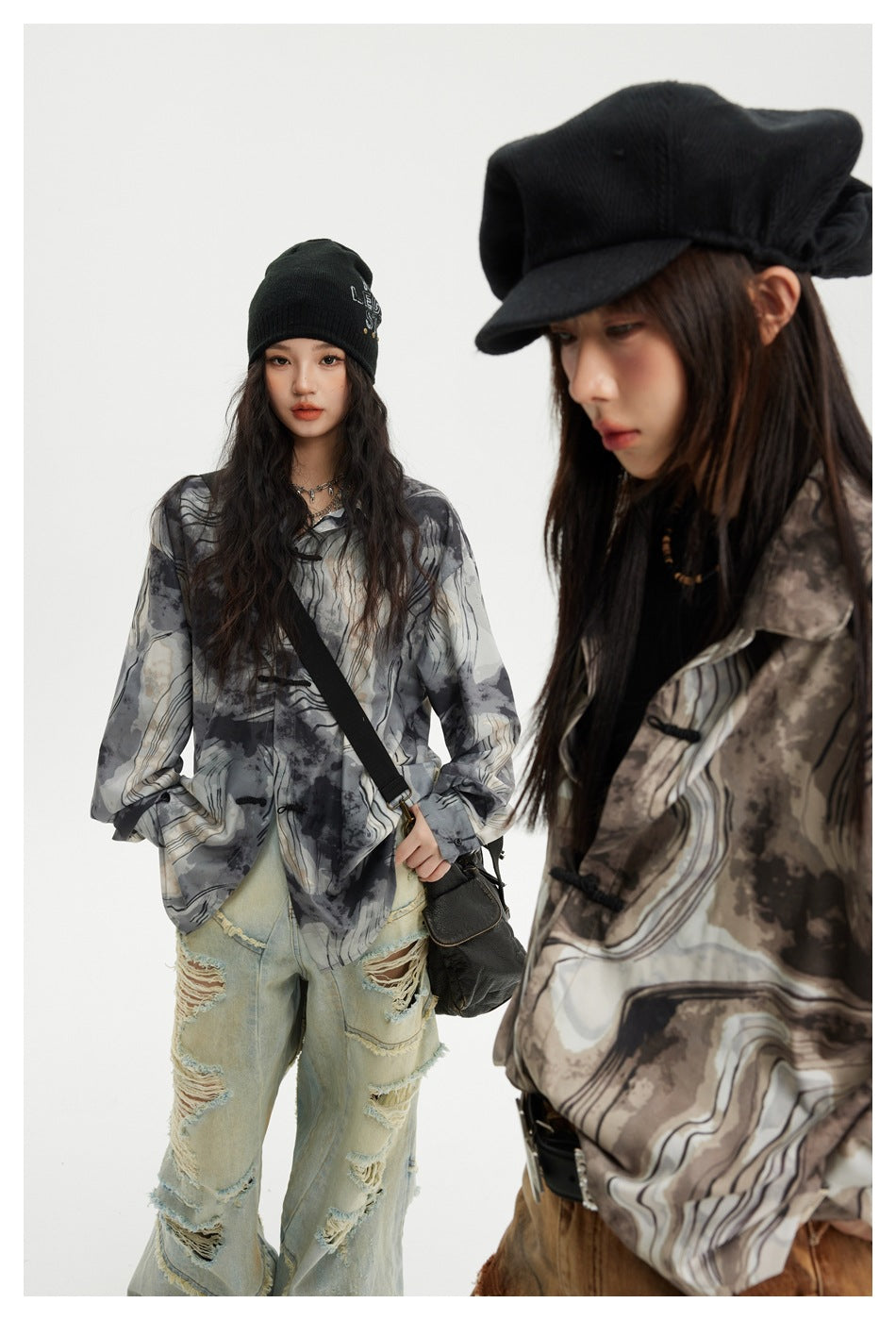 A model wears a loose gray abstract-pattern shirt with distressed light jeans; another model in a brown-toned version is