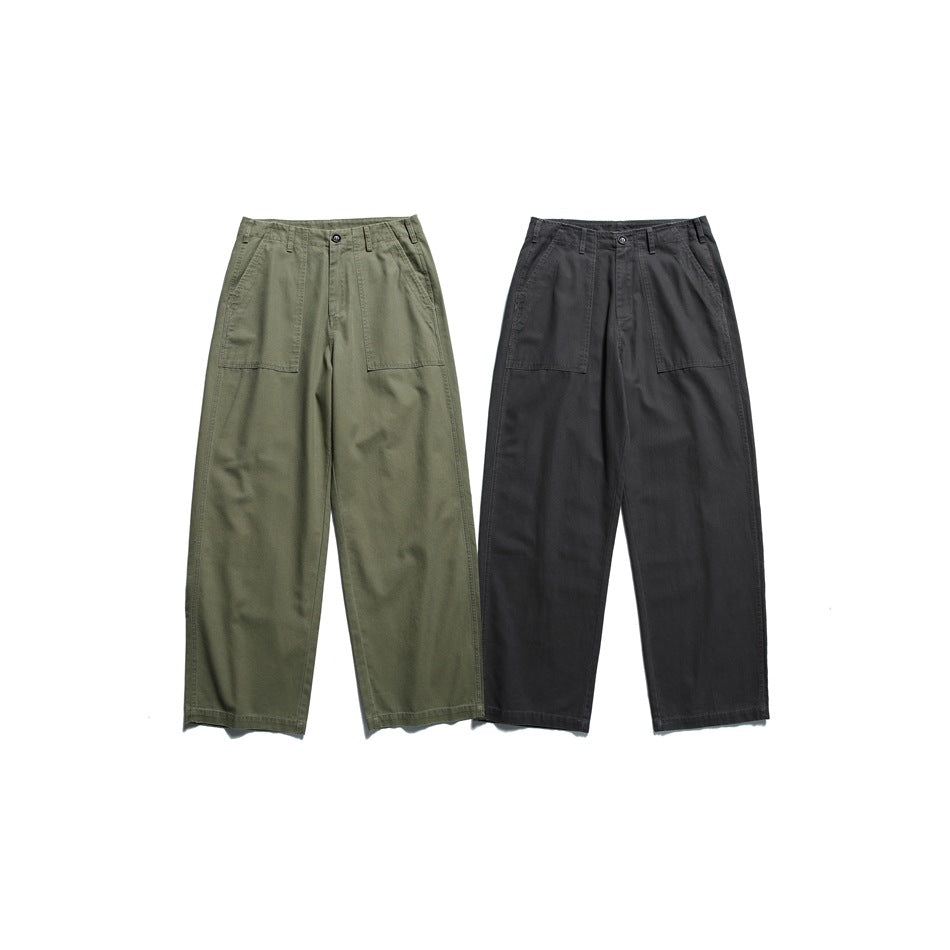 Two pairs of wide-leg trousers shown from the front in olive green and charcoal, with large front pockets.
