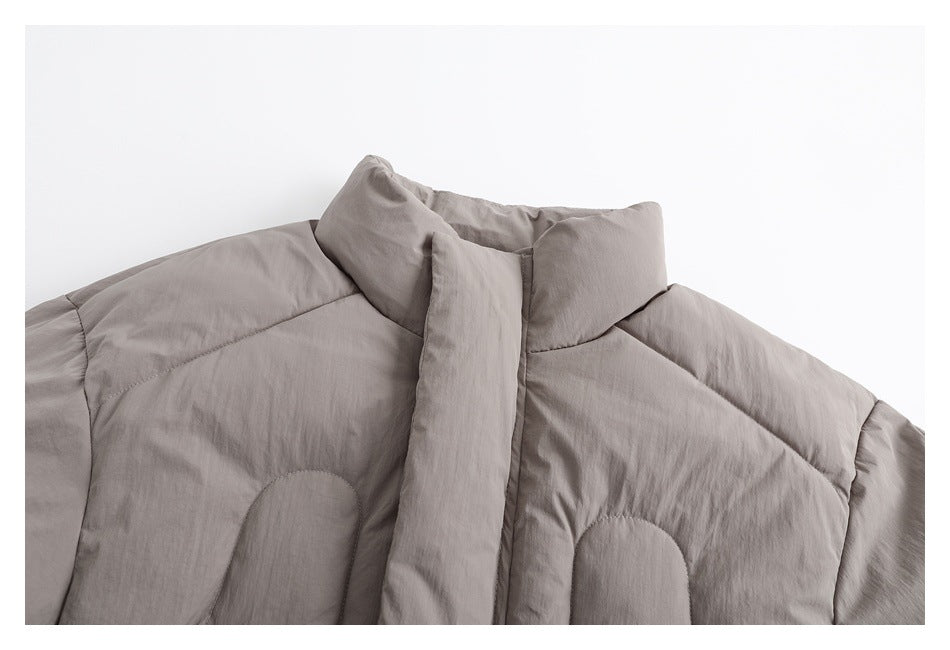 Close-up of a taupe padded jacket collar and front placket on a white background.