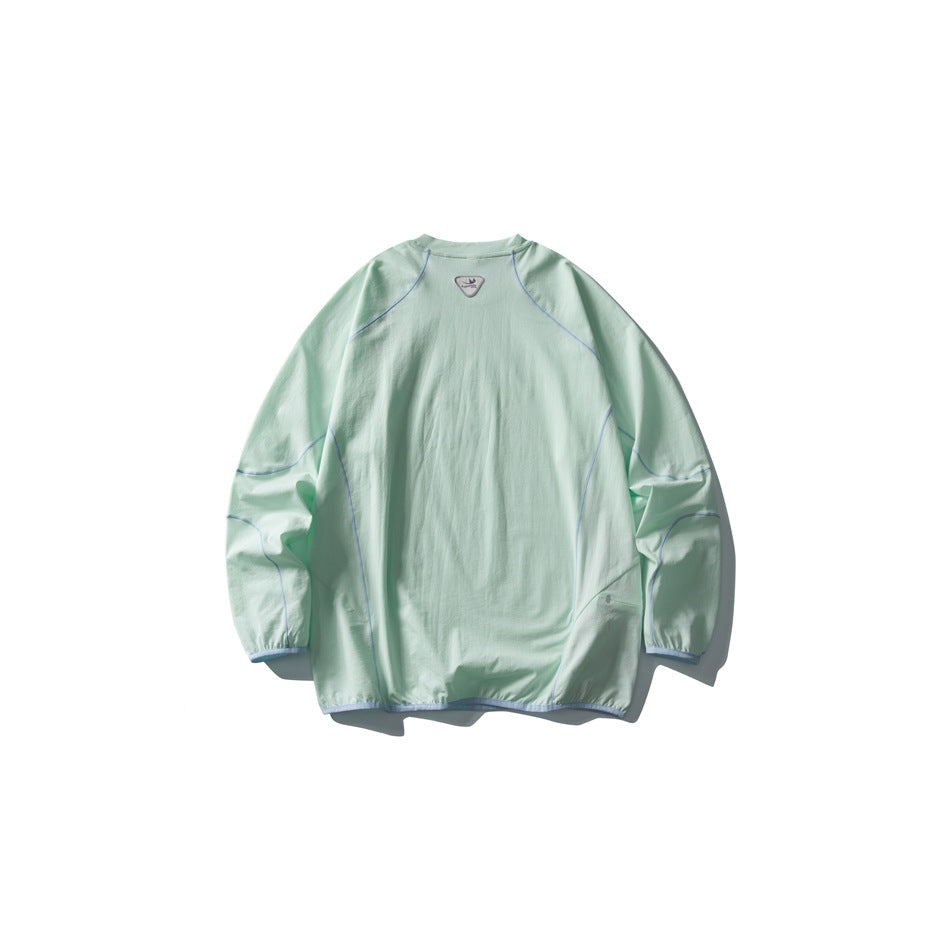 Mint-green long-sleeve crewneck pullover shown from the back, with blue-gray seam piping and a small neck emblem.
