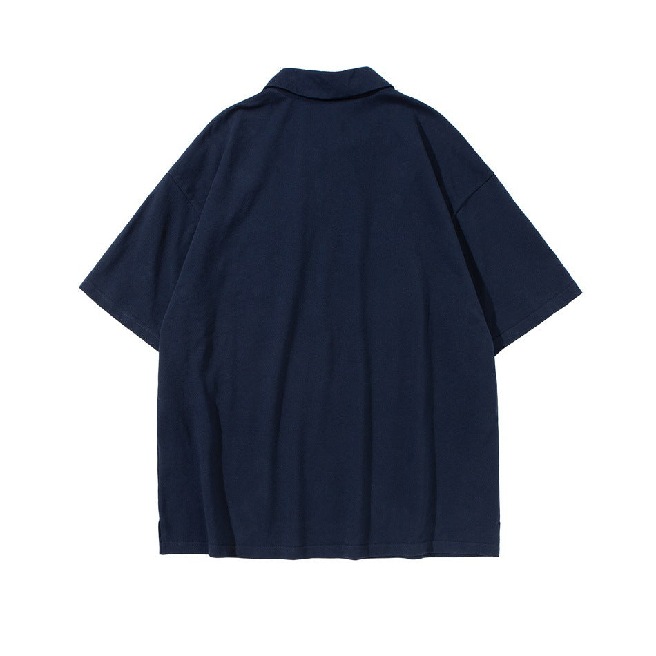 Back view of a navy short-sleeve collared shirt on a white background.