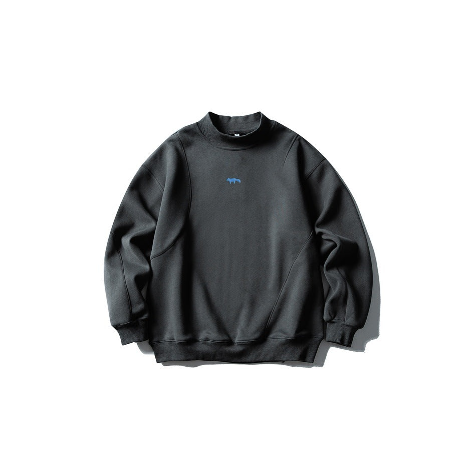 Dark gray mock-neck pullover sweatshirt with small blue fox logo and curved seams, flat lay front view