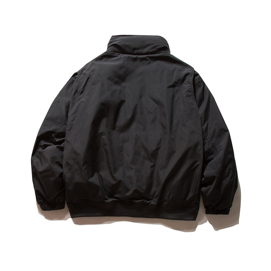 Back view of black stand-collar jacket with elastic cuffs and ribbed hem, flat lay