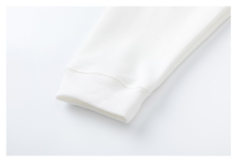 Close-up of a white sleeve ending in a wide ribbed cuff.