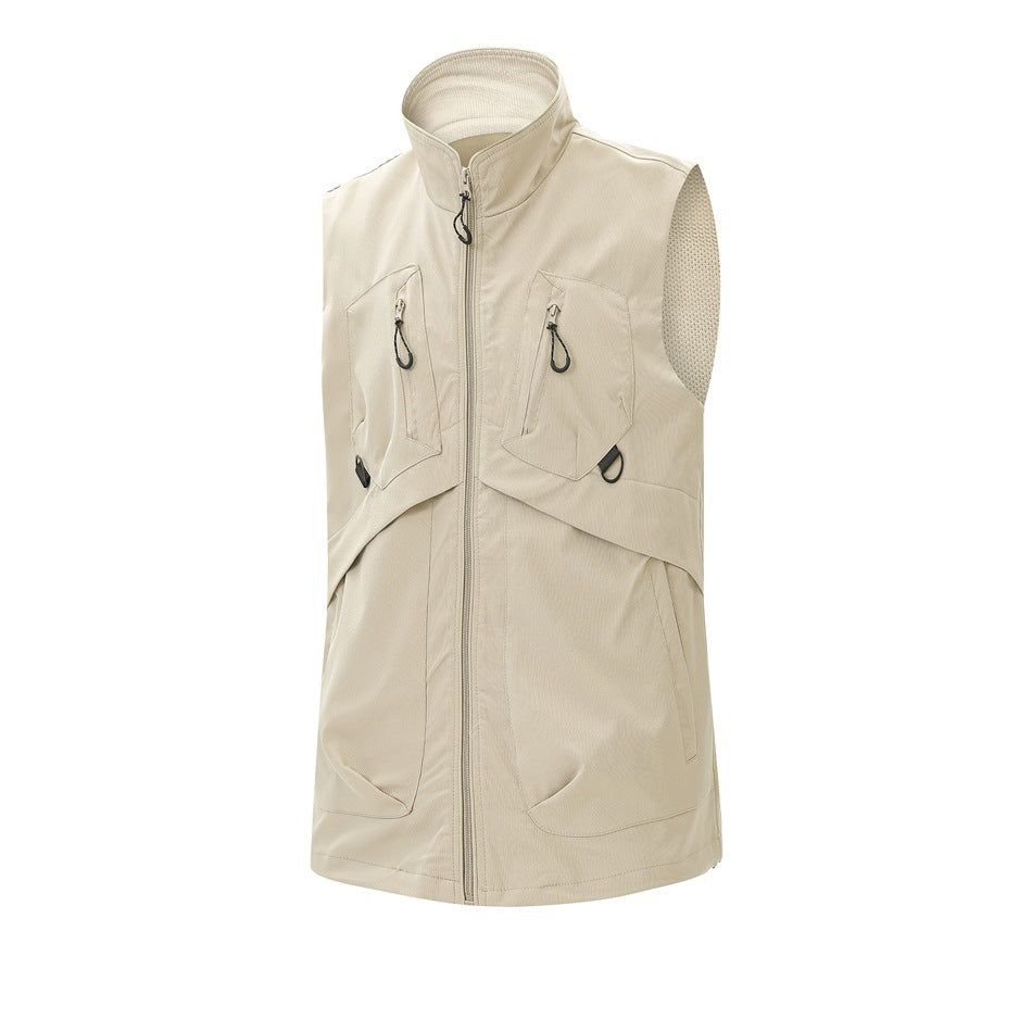 Light beige sleeveless utility vest with a stand collar, front zipper, and multiple zippered pockets.