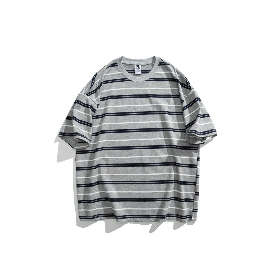 Front of a gray T-shirt with dark and white horizontal stripes, shown flat against a white background.