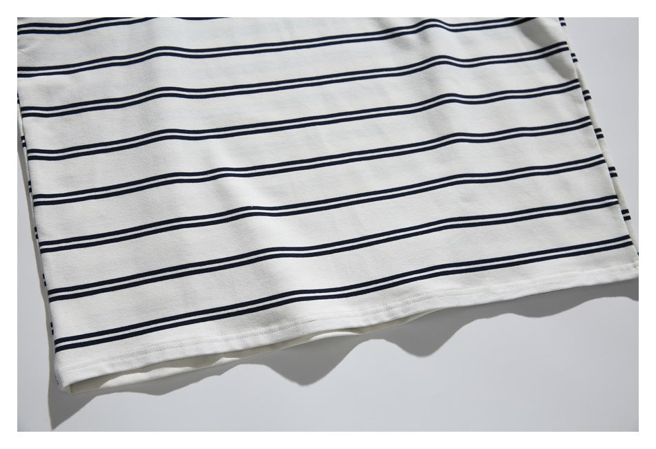 Close-up of the striped top's lower hem and straight stitching.