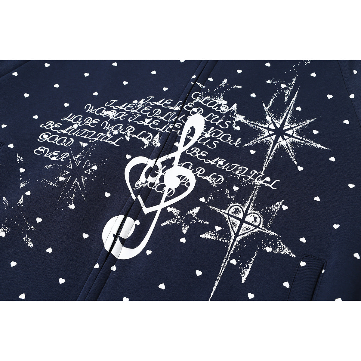 Close-up of a navy zip hoodie with white heart print and a large white treble-clef and starburst graphic.