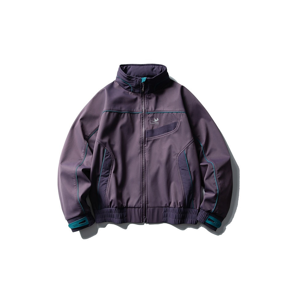 Purple stand-collar zip jacket with teal piping, dark panels and teal cuff tabs, flat lay front view