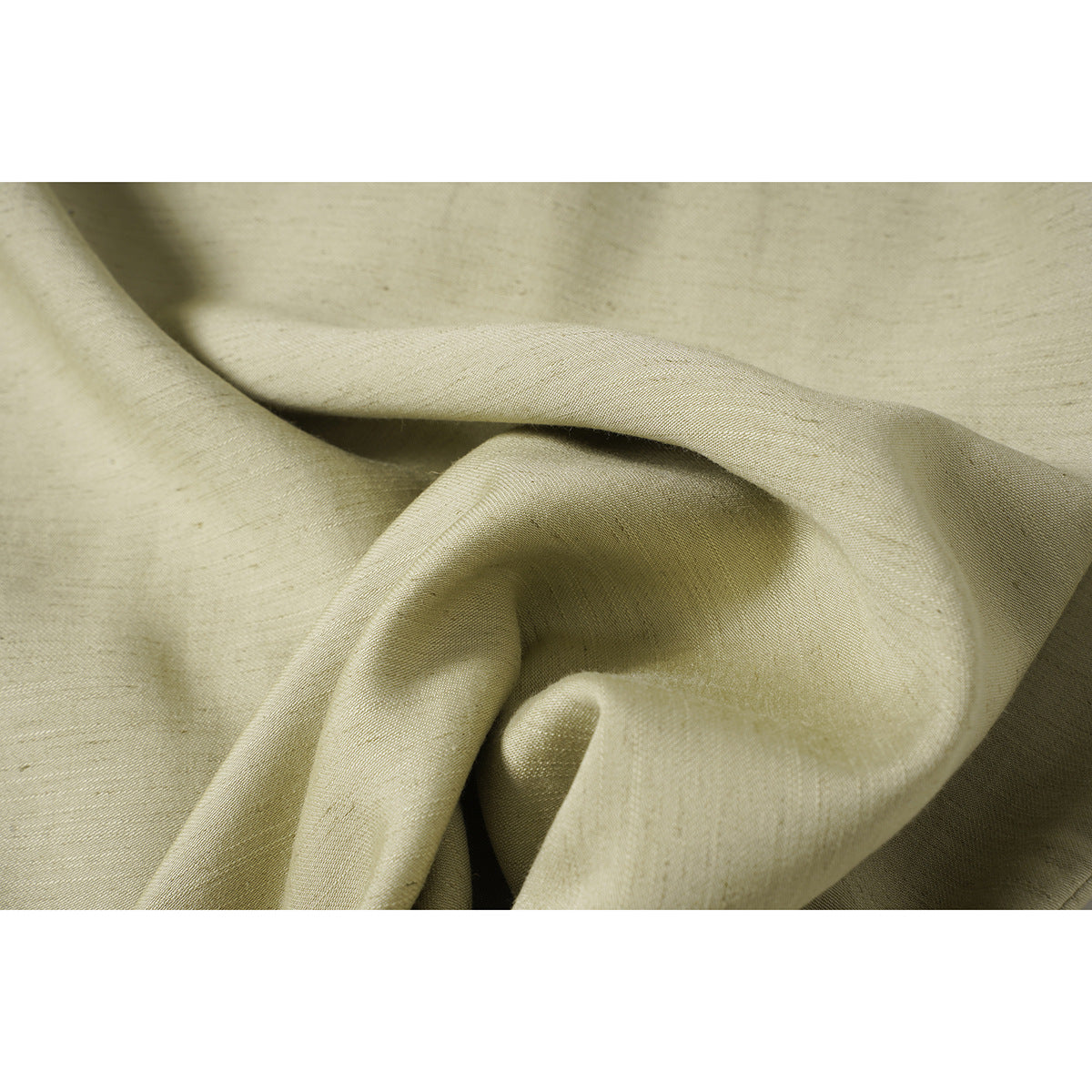 Close-up of pale beige fabric draped to show its subtle woven texture.