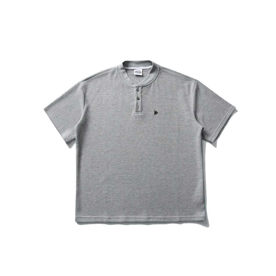 Heather gray waffle-knit short-sleeve henley tee with band collar, two buttons and small chest logo, flat lay