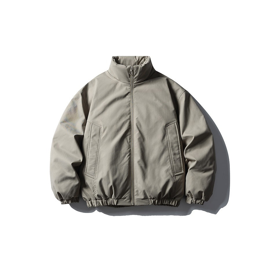 Gray stand-collar zip-up puffer jacket, front flat view, with slanted pockets and elastic cuffs
